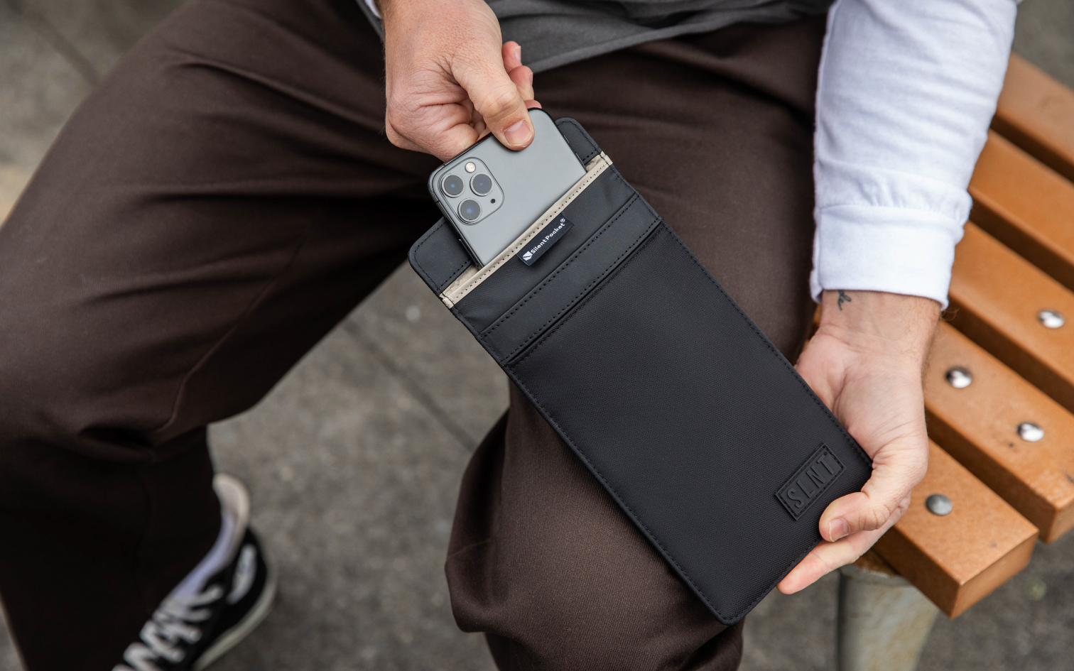 Man holding a Faraday bag for phones