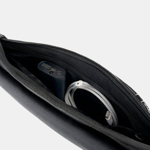 Essentials Faraday Sling open with tech accessories