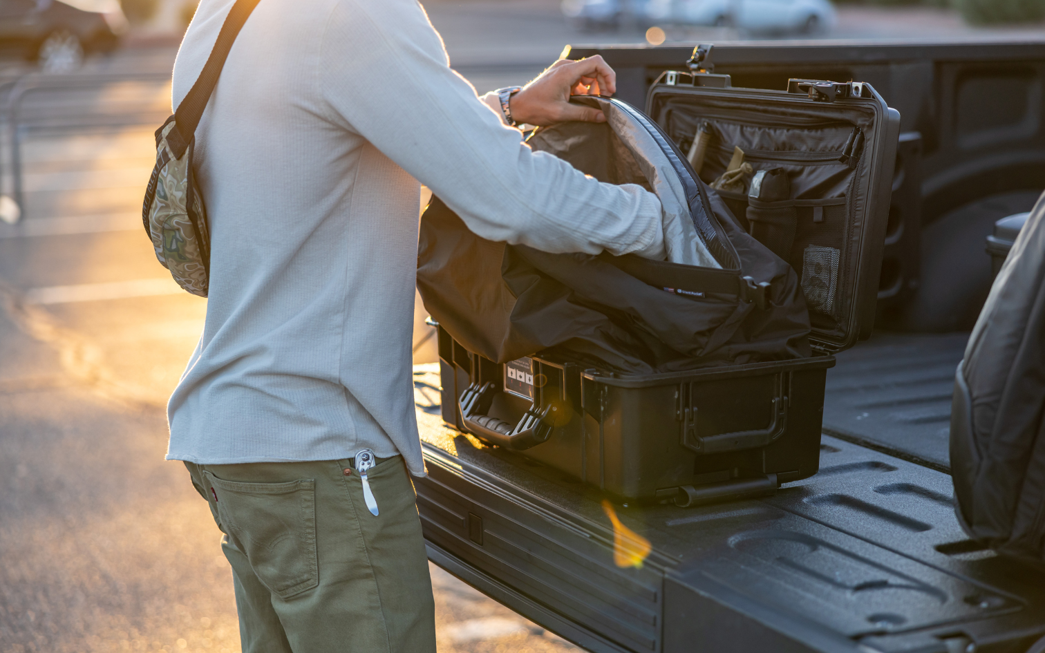 Man putting devices into a Faraday lined hard case