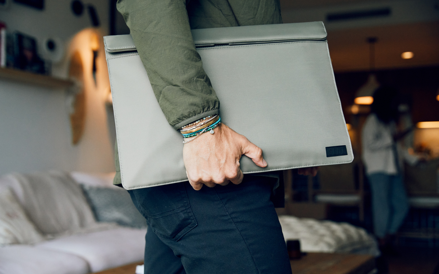 Man carrying a Faraday Laptop Sleeve