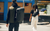 People crossing street with SLNT bags