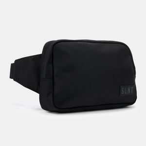 A sleek black Compact Faraday Sling by SLNT, designed with signal-blocking technology. The bag features a Faraday cage interior that blocks RFID, GPS, Wi-Fi, and cellular signals, protecting devices and reducing EMF radiation.