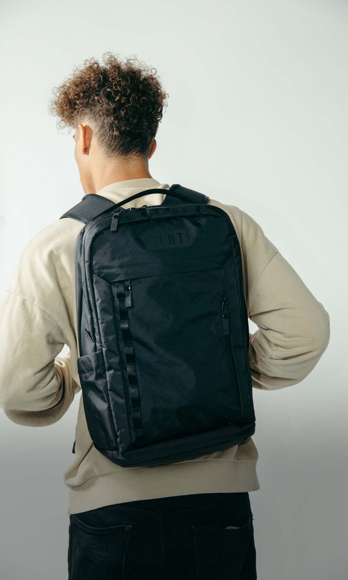 Man wearing SLNT E3 Faraday Backpack