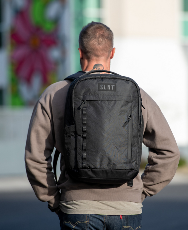 Man wearing SLNT E3 Faraday Backpack