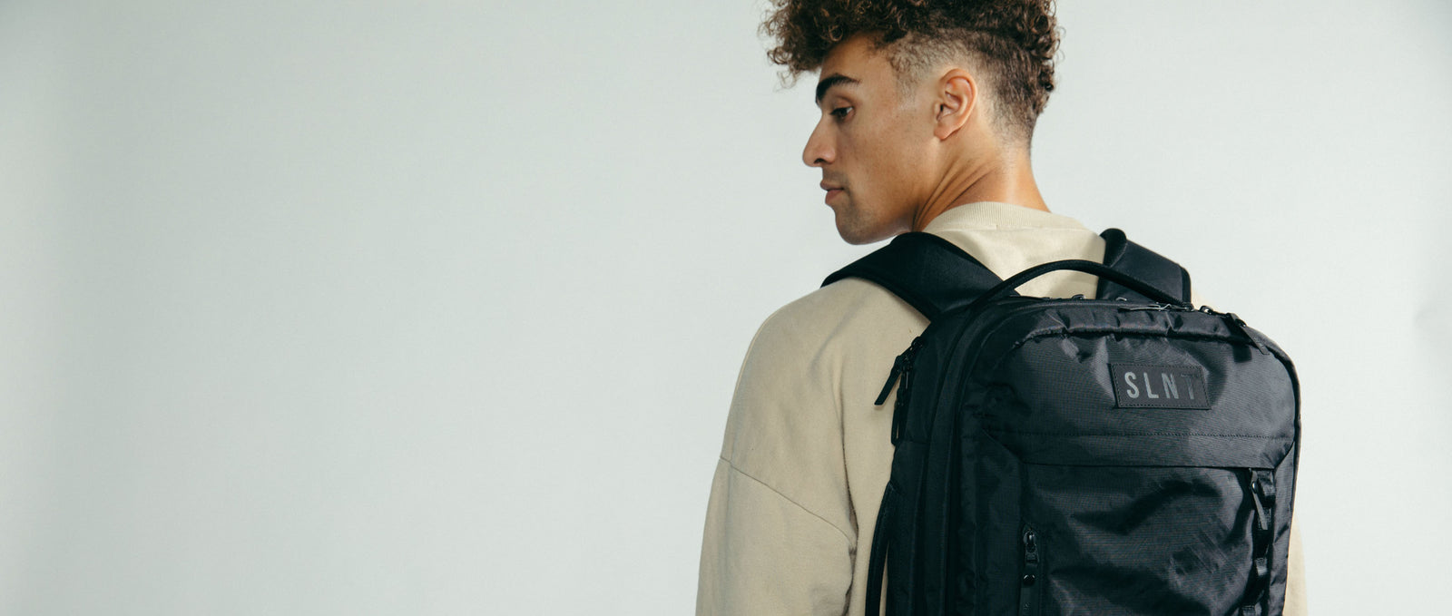 Man wearing SLNT E3 Faraday Backpack