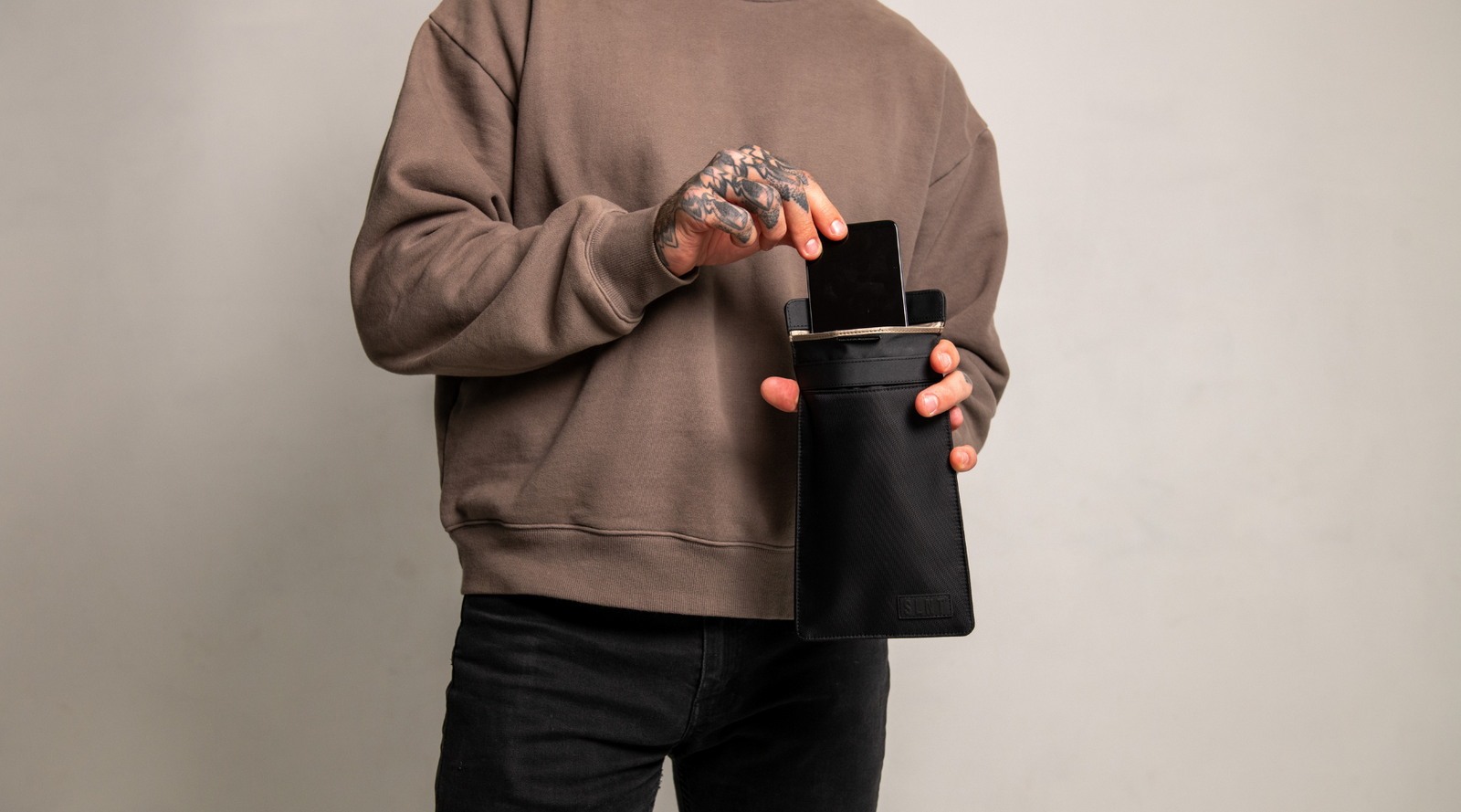 Man with SLNT Faraday Phone Sleeve