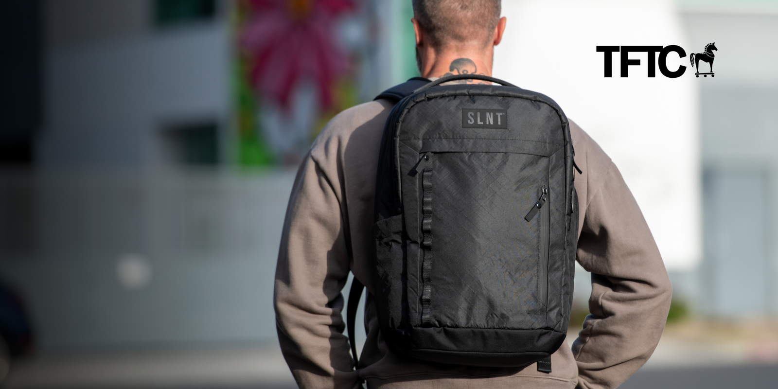 Man wearing a SLNT Faraday Backpack